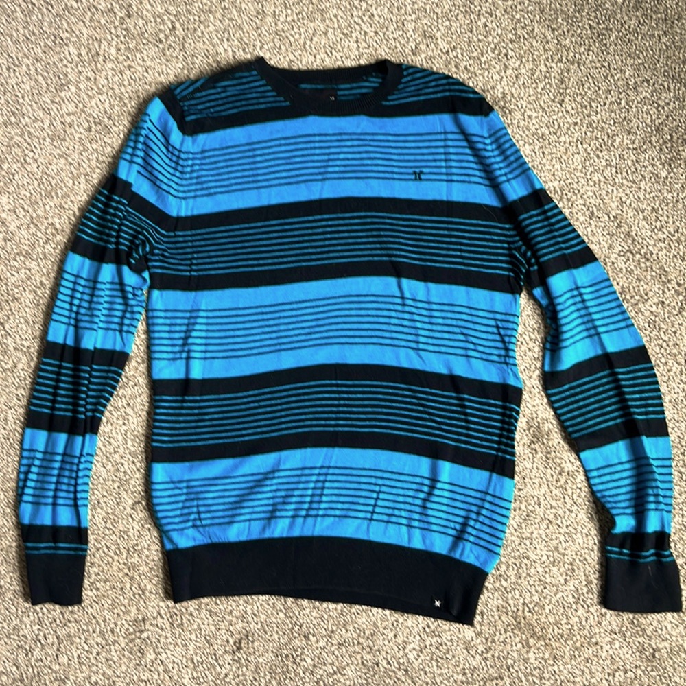 Black and blue striped Hurley knit sweater in great condition. Size medium.